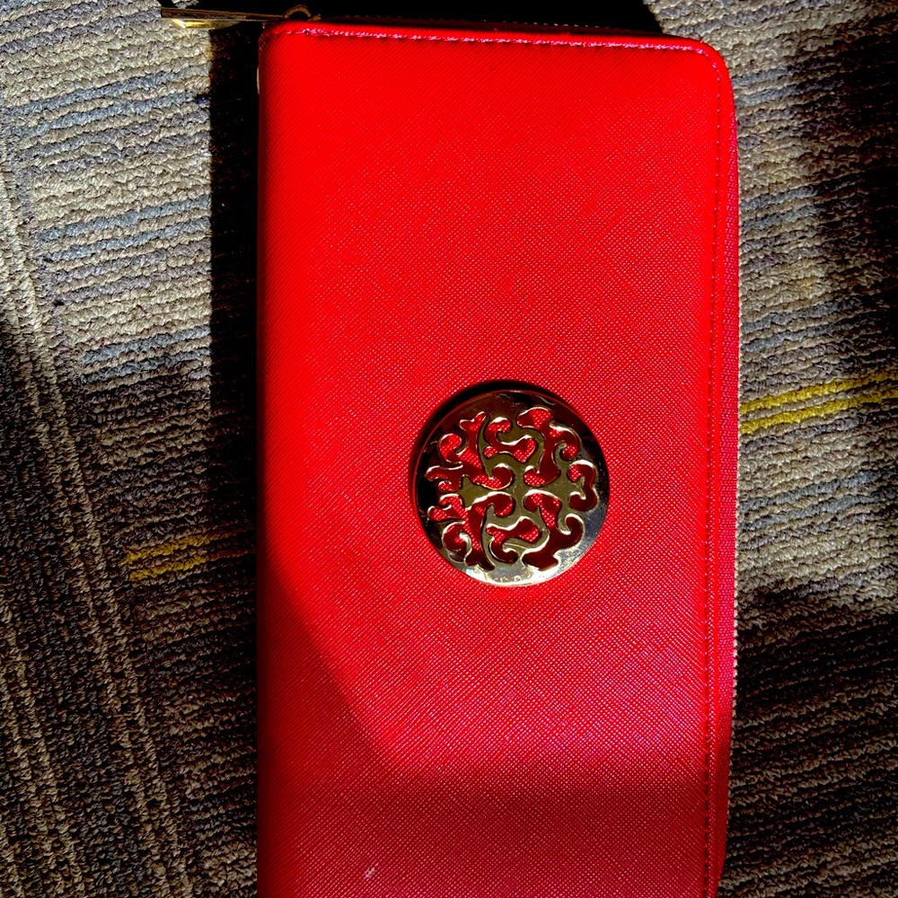Red wallet with a detachable wristlet